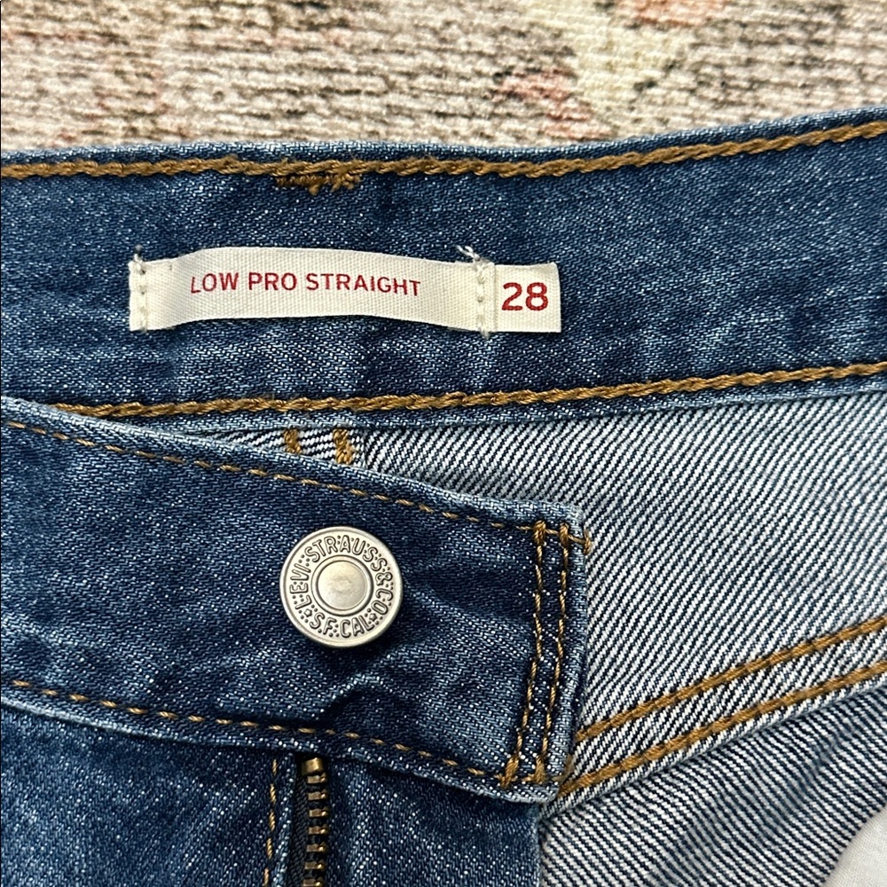 Woman’s Dark Blue Distressed Levi’s Low Pro Straight